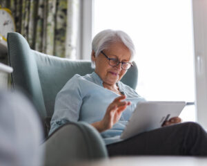 Senior receiving in-home tech support from MOPC Network in Pictou County